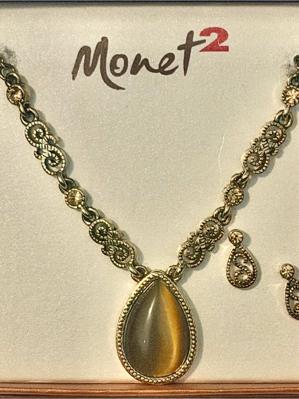 Monet Gold-Tone Teardrop Pendant Necklace with matching earrings.